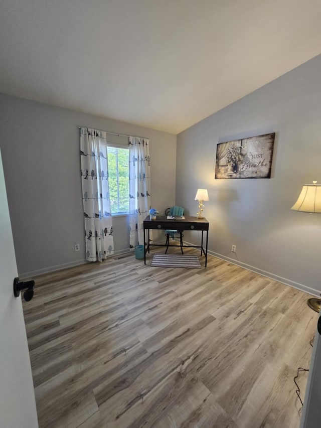 506 S N St, Alpena, MI 49707 - office space featuring wood finished floors and vaulted ceiling