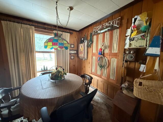 119 Ethel Dr, Roscommon, MI 48653 - dining area with wooden walls