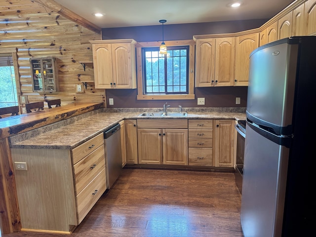 5283 Griffin Rd, Lewiston, MI 49756 - kitchen featuring stainless steel appliances, light brown cabinetry, a peninsula, dark wood finished floors, and hanging light fixtures