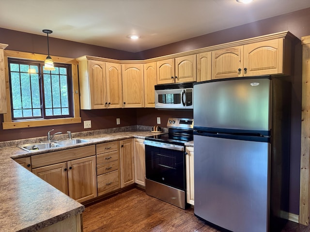 5283 Griffin Rd, Lewiston, MI 49756 - kitchen featuring appliances with stainless steel finishes, light brown cabinetry, dark wood finished floors, decorative light fixtures, and recessed lighting