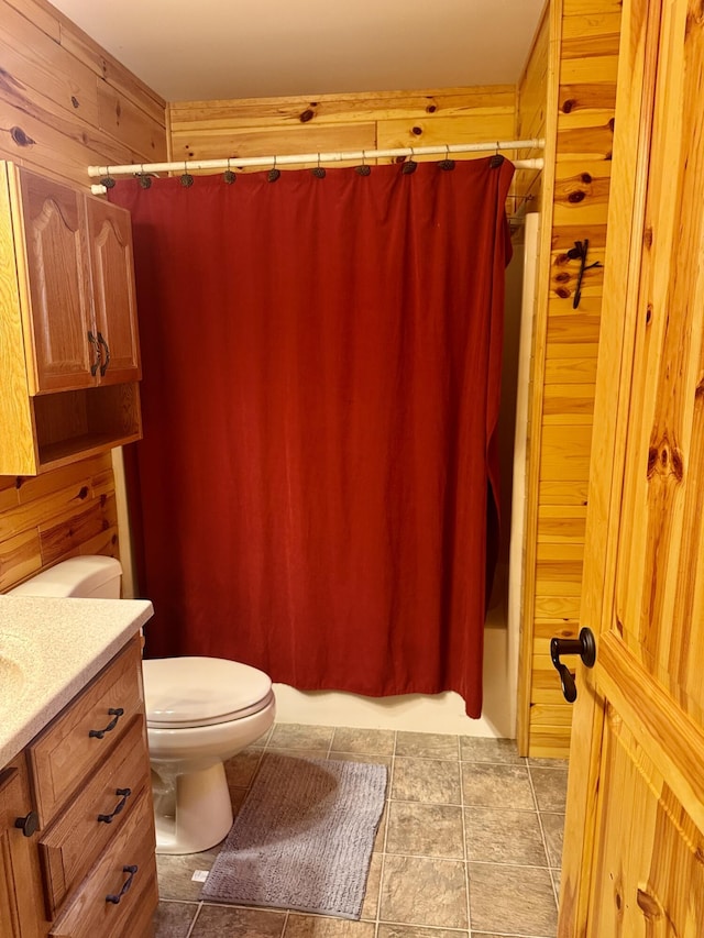 5283 Griffin Rd, Lewiston, MI 49756 - bathroom featuring vanity, shower / bathtub combination with curtain, and wooden walls