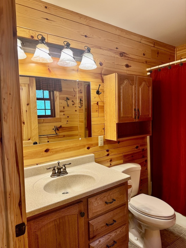 5283 Griffin Rd, Lewiston, MI 49756 - full bathroom with vanity, a shower with shower curtain, wood walls, and tile patterned floors