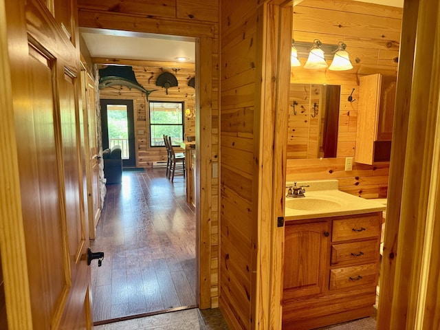 5283 Griffin Rd, Lewiston, MI 49756 - hall featuring wood walls and dark wood-style flooring