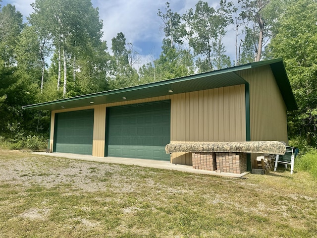 5283 Griffin Rd, Lewiston, MI 49756 - view of property exterior featuring an outbuilding and a garage