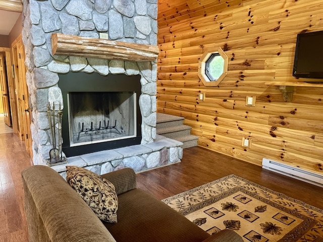 5283 Griffin Rd, Lewiston, MI 49756 - living room with wood finished floors, rustic walls, and stairs