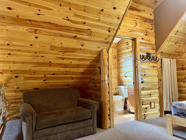 5283 Griffin Rd, Lewiston, MI 49756 - sitting room with rustic walls, lofted ceiling, wood ceiling, and carpet flooring