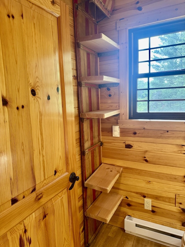 5283 Griffin Rd, Lewiston, MI 49756 - detailed view of baseboard heating and wooden walls