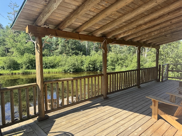 5283 Griffin Rd, Lewiston, MI 49756 - wooden terrace with a water view