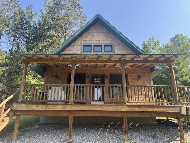 5283 Griffin Rd, Lewiston, MI 49756 - rear view of house featuring covered porch