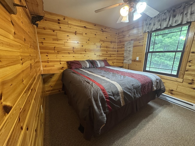 5283 Griffin Rd, Lewiston, MI 49756 - carpeted bedroom with wood walls, multiple windows, a baseboard radiator, and ceiling fan