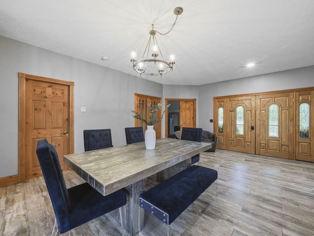 6552 High Trees Ct, Gaylord, MI 49735 - dining space featuring a chandelier, light wood-type flooring, and recessed lighting