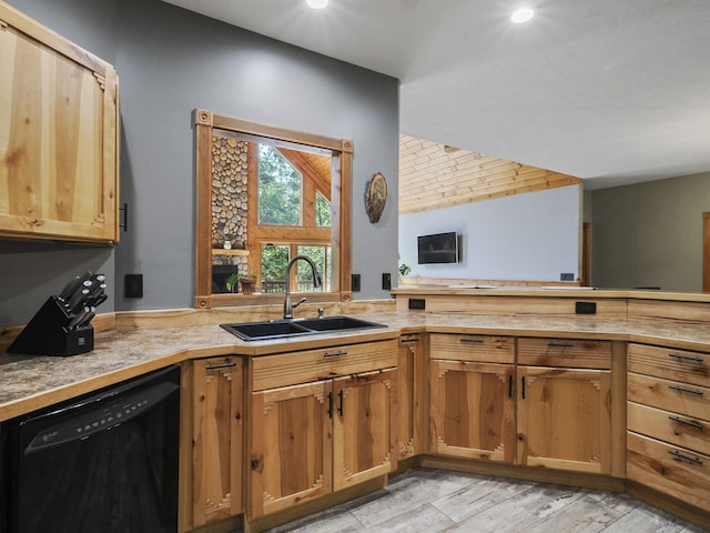 6552 High Trees Ct, Gaylord, MI 49735 - kitchen with black dishwasher, light countertops, light wood-style floors, recessed lighting, and vaulted ceiling