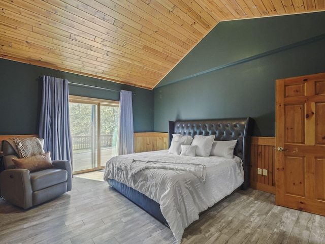 6552 High Trees Ct, Gaylord, MI 49735 - bedroom featuring wooden ceiling, wainscoting, access to outside, wood finished floors, and wooden walls
