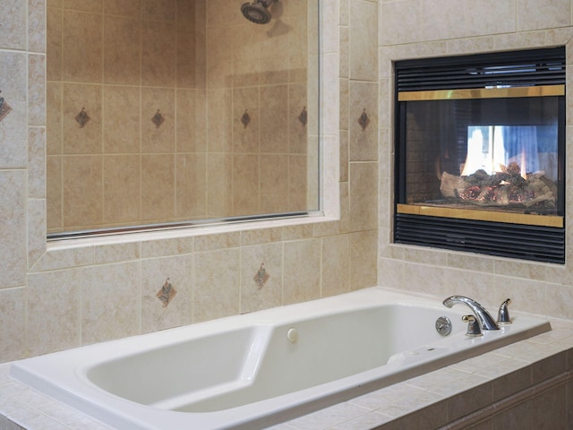 6552 High Trees Ct, Gaylord, MI 49735 - bathroom featuring a bath and a multi sided fireplace