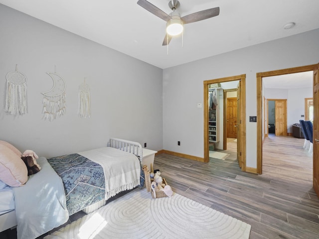 6552 High Trees Ct, Gaylord, MI 49735 - bedroom with wood finished floors and a ceiling fan