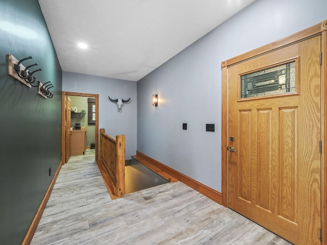 6552 High Trees Ct, Gaylord, MI 49735 - hall with an upstairs landing, light wood finished floors, and recessed lighting