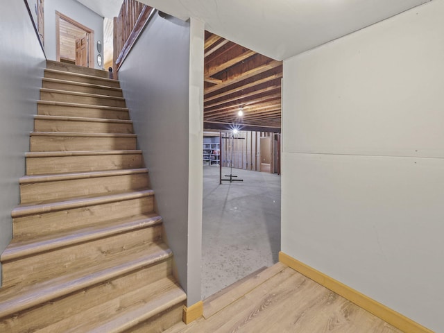 6552 High Trees Ct, Gaylord, MI 49735 - stairs featuring baseboards