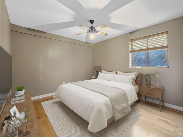 6552 High Trees Ct, Gaylord, MI 49735 - bedroom with light wood-style flooring and a ceiling fan