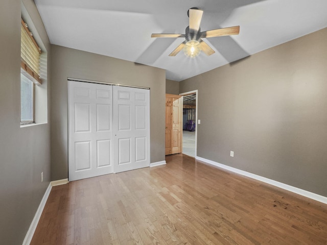 6552 High Trees Ct, Gaylord, MI 49735 - unfurnished bedroom featuring wood finished floors, a closet, and ceiling fan