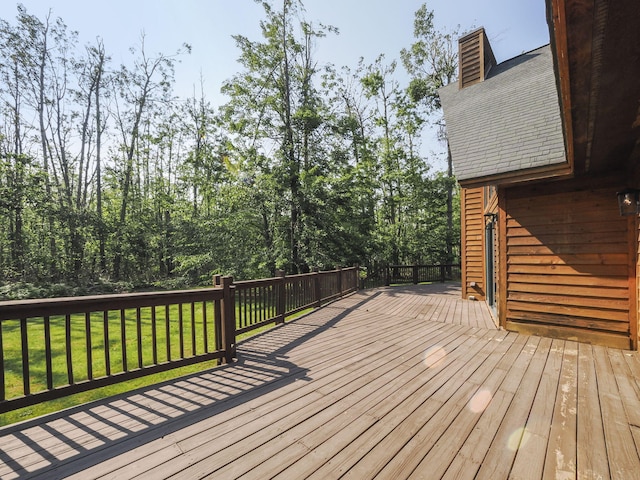 6552 High Trees Ct, Gaylord, MI 49735 - wooden deck featuring a lawn