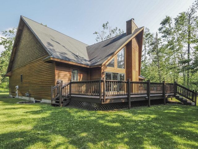 6552 High Trees Ct, Gaylord, MI 49735 - back of property featuring a chimney, a wooden deck, a lawn, roof with shingles, and stairway