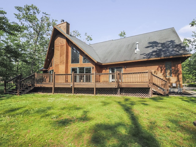 6552 High Trees Ct, Gaylord, MI 49735 - back of property with stairway, a chimney, a wooden deck, and a lawn