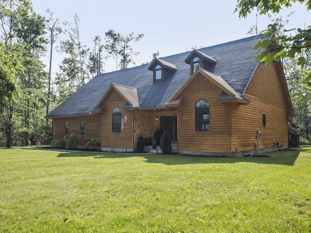 6552 High Trees Ct, Gaylord, MI 49735 - view of front of house with a front lawn and a shingled roof