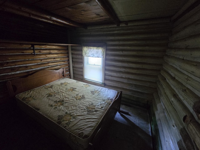 899 Bills Rd, Mio, MI 48647 - bedroom with log walls and a wooden ceiling with exposed beams