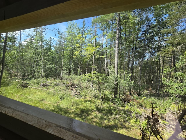899 Bills Rd, Mio, MI 48647 - balcony featuring a wooded view