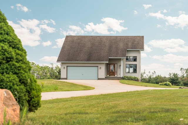 2829 Kassuba Rd, Gaylord, MI 49735 - view of front of house featuring driveway, a front yard, an attached garage, and roof with shingles