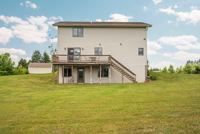 2829 Kassuba Rd, Gaylord, MI 49735 - back of property with a wooden deck, stairway, and a lawn