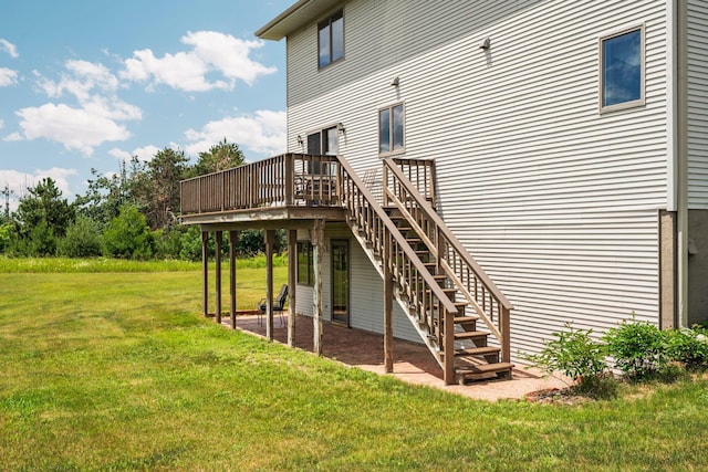 2829 Kassuba Rd, Gaylord, MI 49735 - rear view of house featuring a deck, stairway, and a yard