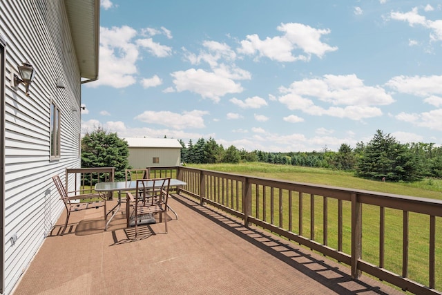 2829 Kassuba Rd, Gaylord, MI 49735 - deck with outdoor dining area and a lawn