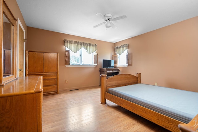 2829 Kassuba Rd, Gaylord, MI 49735 - bedroom with light wood finished floors and a ceiling fan