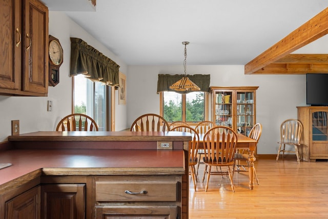 2829 Kassuba Rd, Gaylord, MI 49735 - dining area with plenty of natural light, light wood-style floors, and beamed ceiling