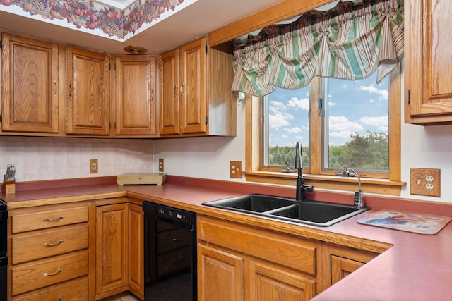 2829 Kassuba Rd, Gaylord, MI 49735 - kitchen featuring black dishwasher, light countertops, brown cabinetry, and backsplash