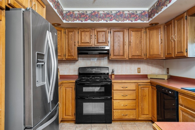 2829 Kassuba Rd, Gaylord, MI 49735 - kitchen with black appliances, exhaust hood, brown cabinetry, and backsplash