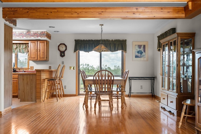 2829 Kassuba Rd, Gaylord, MI 49735 - dining room with plenty of natural light, light wood-type flooring, and beamed ceiling
