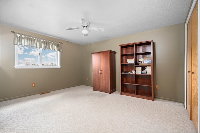 2829 Kassuba Rd, Gaylord, MI 49735 - unfurnished bedroom with light carpet and ceiling fan