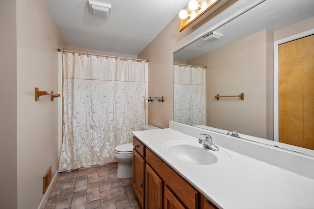 2829 Kassuba Rd, Gaylord, MI 49735 - full bathroom with vanity, stone finish floors, a shower with curtain, and a textured ceiling
