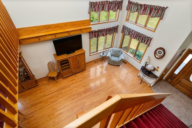 2829 Kassuba Rd, Gaylord, MI 49735 - stairway with wood finished floors and a towering ceiling
