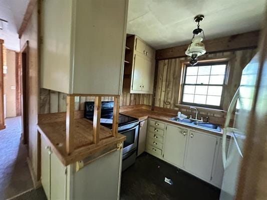 605 N Poor Farm Rd, Harrisville, MI 48740 - kitchen featuring electric range, hanging light fixtures, and open shelves