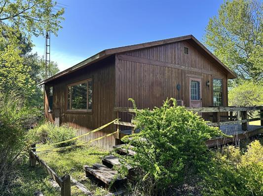 605 N Poor Farm Rd, Harrisville, MI 48740 - view of side of home