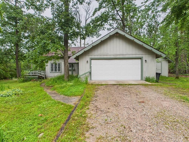 5589 Algonquin Rd, Gaylord, MI 49735 - view of front of property with dirt driveway and a garage