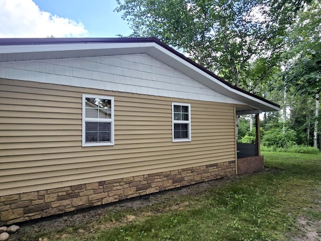 6416 Jimary Ln, Gladwin, MI 48624 - view of side of property with stone siding