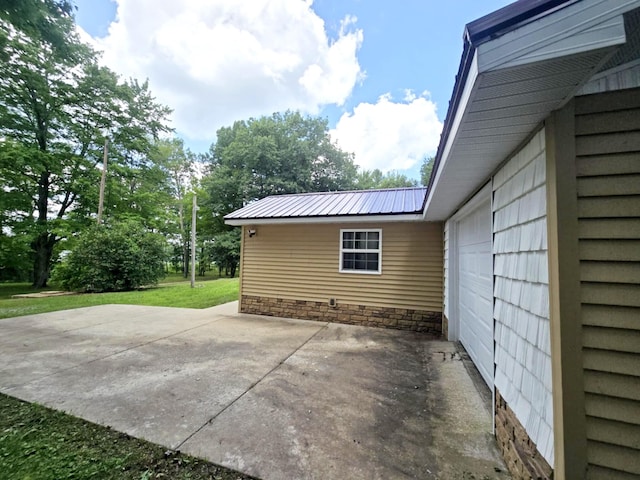 6416 Jimary Ln, Gladwin, MI 48624 - view of patio / terrace featuring a garage