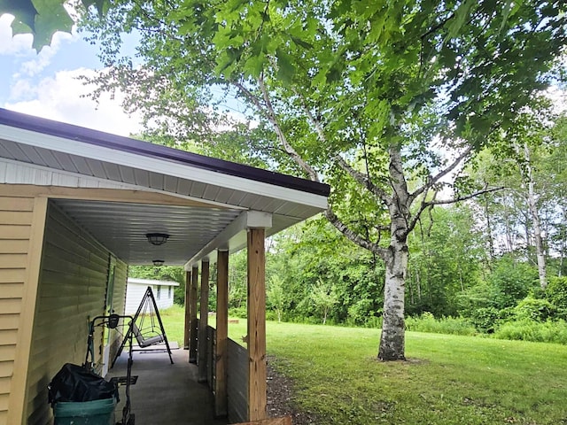 6416 Jimary Ln, Gladwin, MI 48624 - view of grassy yard featuring a porch