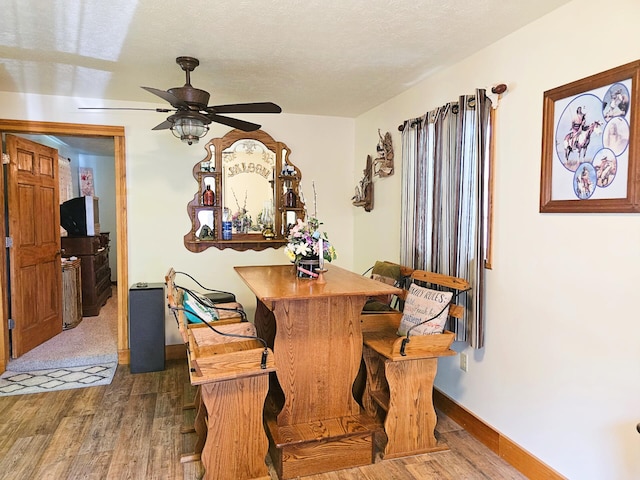 6416 Jimary Ln, Gladwin, MI 48624 - dining area featuring wood finished floors and ceiling fan