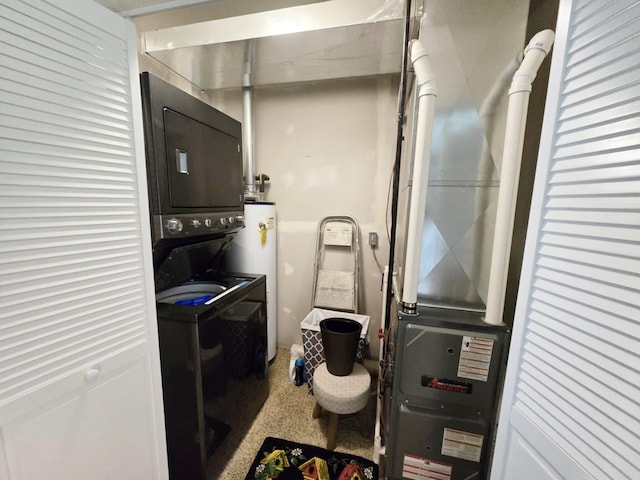 6416 Jimary Ln, Gladwin, MI 48624 - laundry area featuring stacked washer / drying machine and water heater