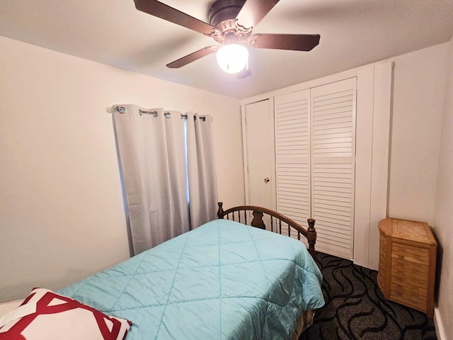6416 Jimary Ln, Gladwin, MI 48624 - bedroom with carpet flooring, ceiling fan, and a closet